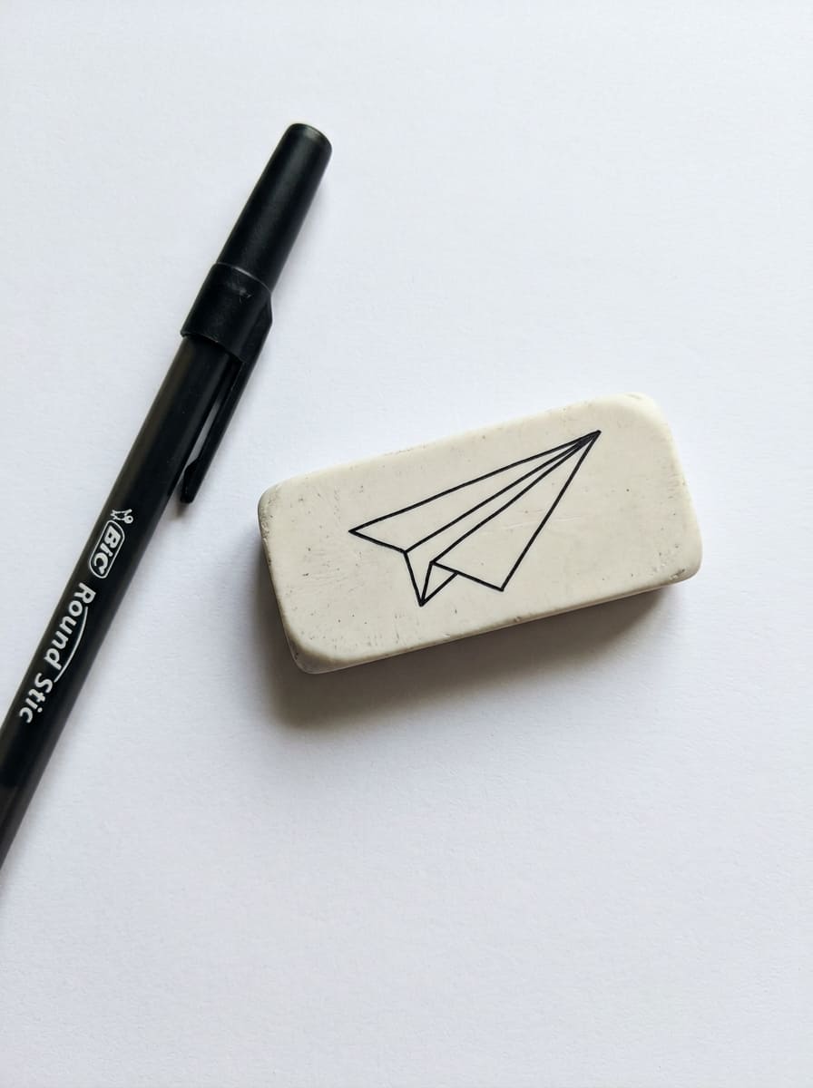 Paper_airplane_outline_on_eraser_drawing_idea
